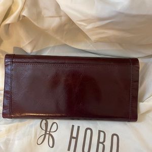 Hobo brand fable tri-fold wallet. Excellent condition. Deep rich merlot color
